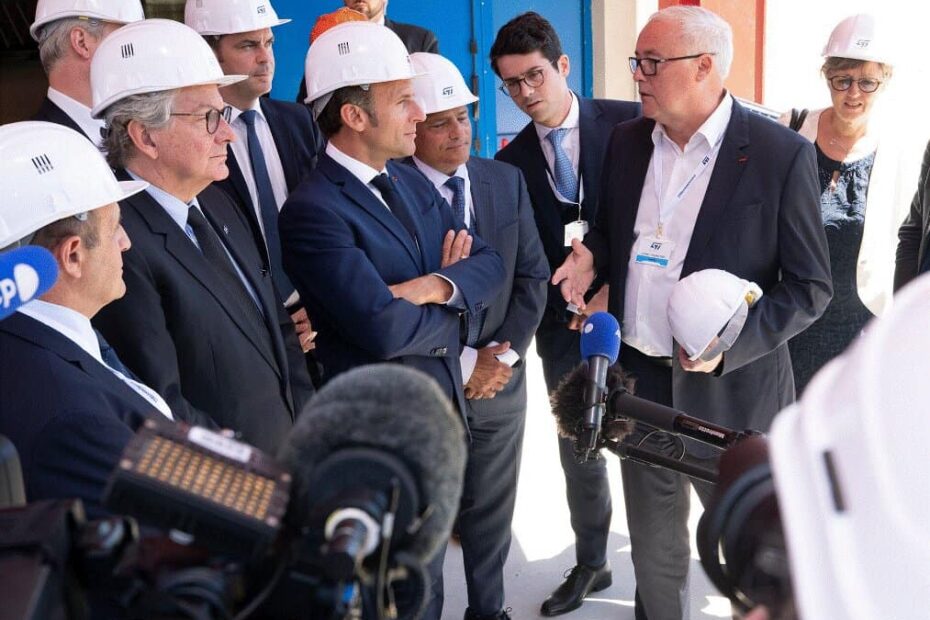 Emmanuel Macron, President of France (in the center) listens to Jean-Marc Chery, STMicroelectronics CEO talks. Thierry Breton, EU Commissioner for Internal Market stands next to Macron.